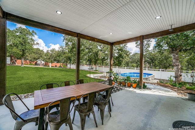 view of patio / terrace with a fenced backyard, a fenced in pool, and outdoor dining space