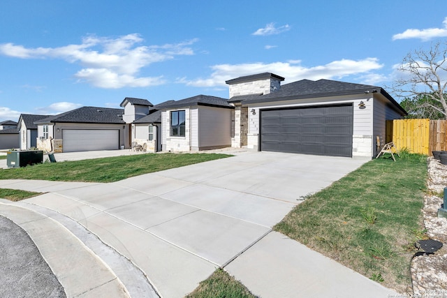9923 Loma Alta, Converse, TX 78109 - view of front of home with an attached garage, driveway, and stone siding