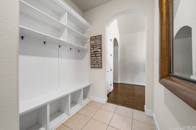13606 Beck Ml, San Antonio, TX 78253 - mudroom with tile patterned floors, baseboards, and arched walkways