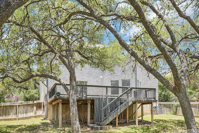 2414 Melrose Cyn, San Antonio, TX 78232 - rear view of house with a deck, a fenced backyard, stairway, and brick siding
