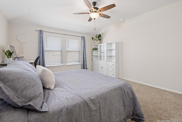 bedroom featuring baseboards, carpet floors, and ceiling fan