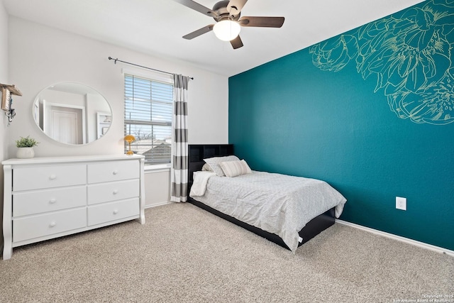 bedroom featuring ceiling fan, baseboards, and light carpet