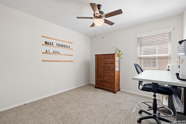 home office featuring baseboards, light colored carpet, and ceiling fan