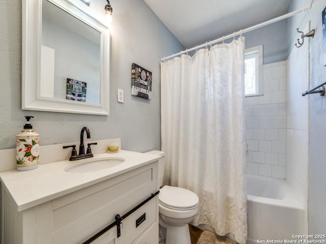 bathroom featuring toilet, vanity, and shower / tub combo