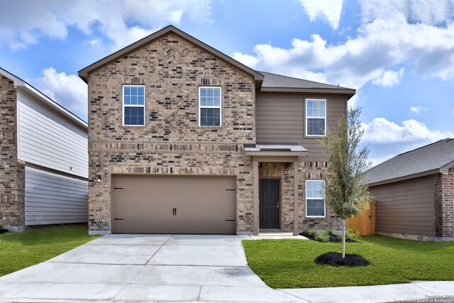 14914 Telfaire Mdw, Von Ormy, TX 78073 - traditional-style house featuring brick siding, an attached garage, concrete driveway, and a front yard
