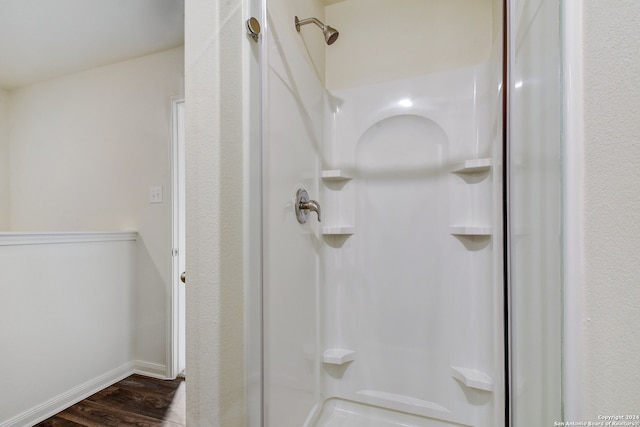 14914 Telfaire Mdw, Von Ormy, TX 78073 - full bath with a shower stall, baseboards, and wood finished floors
