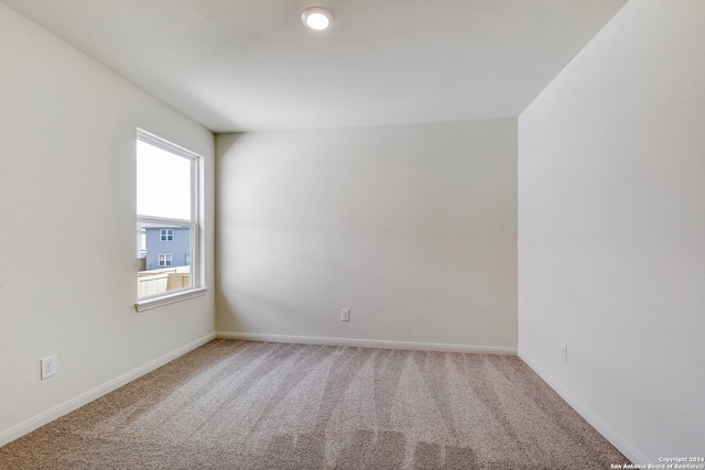14914 Telfaire Mdw, Von Ormy, TX 78073 - carpeted empty room featuring baseboards