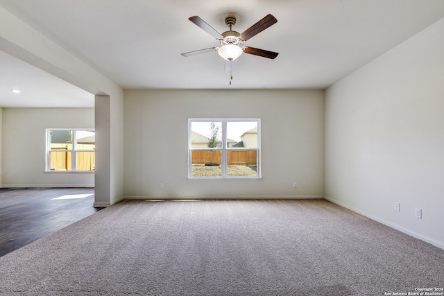 14914 Telfaire Mdw, Von Ormy, TX 78073 - spare room featuring a ceiling fan, carpet flooring, and a healthy amount of sunlight