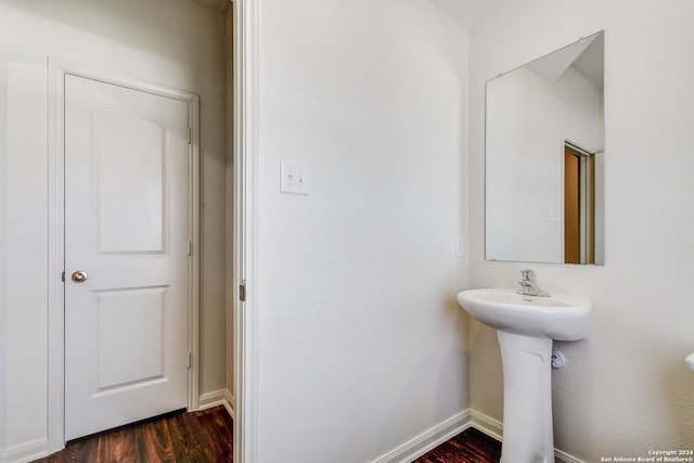 14914 Telfaire Mdw, Von Ormy, TX 78073 - bathroom with baseboards and wood finished floors