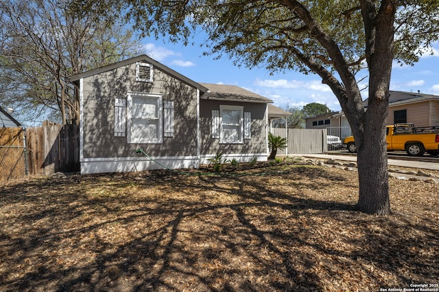 view of front of home featuring fence