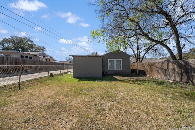 view of yard with a fenced backyard