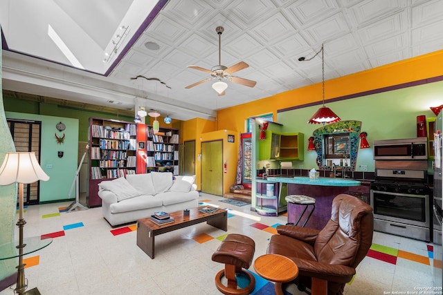 1651 W Woodlawn, San Antonio, TX 78201 - living area featuring tile patterned floors, an ornate ceiling, and ceiling fan