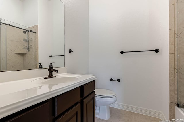 bathroom featuring walk in shower, tile patterned flooring, vanity, toilet, and baseboards