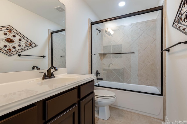 full bathroom with tile patterned flooring, visible vents, vanity, toilet, and combined bath / shower with glass door