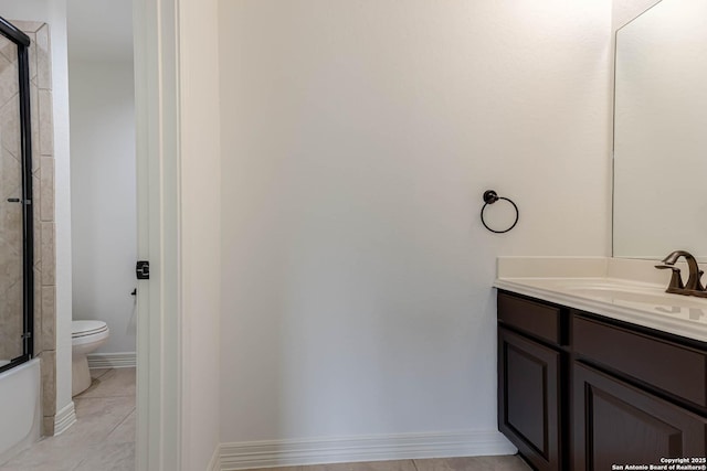 full bathroom featuring tile patterned flooring, vanity, a bathing tub, toilet, and an enclosed shower