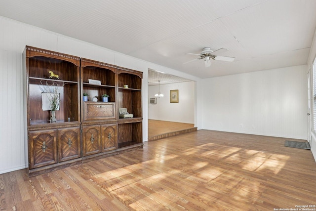 unfurnished living room featuring light wood finished floors and ceiling fan