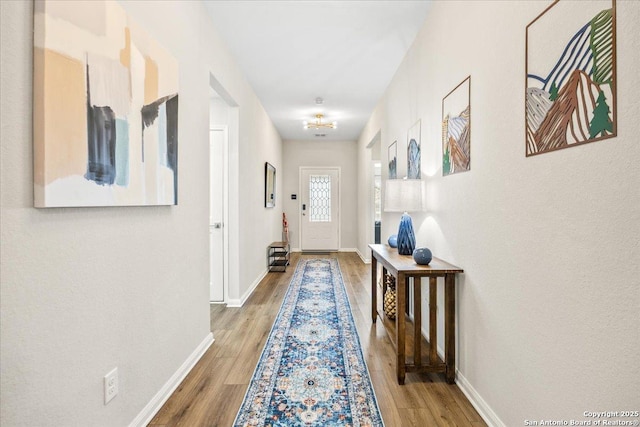 9314 Nubuck, Converse, TX 78109 - doorway with wood finished floors and baseboards