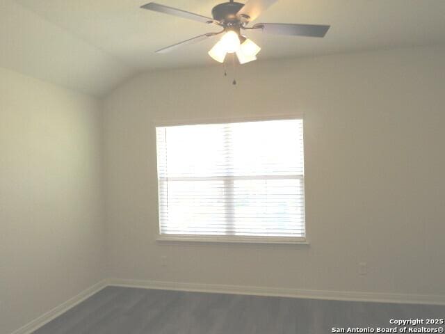 10314 Candlewood Way, San Antonio, TX 78245 - spare room with baseboards, dark wood-type flooring, a ceiling fan, and vaulted ceiling