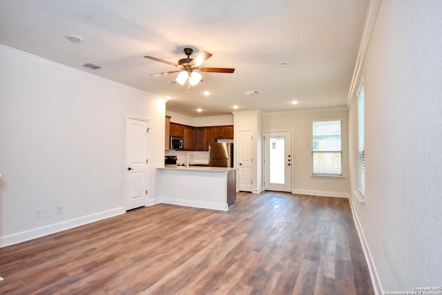 10314 Candlewood Way, San Antonio, TX 78245 - unfurnished living room featuring ornamental molding, a sink, ceiling fan, dark wood-type flooring, and baseboards