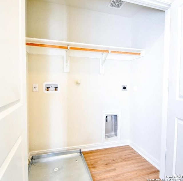 10314 Candlewood Way, San Antonio, TX 78245 - laundry area featuring washer hookup, hookup for an electric dryer, hookup for a gas dryer, and light wood finished floors