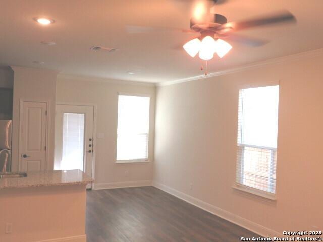 10314 Candlewood Way, San Antonio, TX 78245 - kitchen featuring ornamental molding, a ceiling fan, dark wood-style floors, a sink, and baseboards