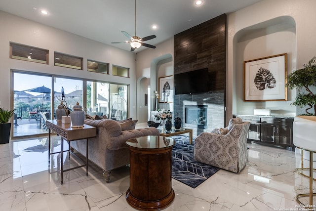 21335 Rembrandt, San Antonio, TX 78256 - living room with arched walkways, recessed lighting, marble finish floor, and a ceiling fan