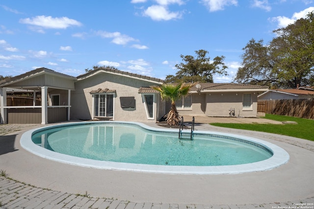 view of swimming pool with a fenced in pool and fence