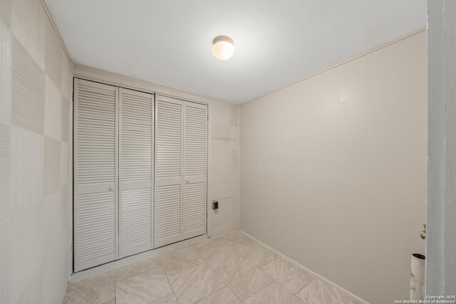unfurnished bedroom with a closet