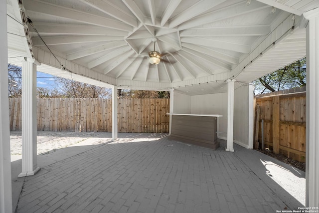view of patio / terrace featuring fence