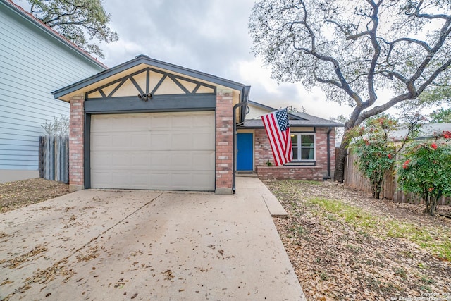 12938 Ocean Glade, San Antonio, TX 78249 - view of front of property with driveway, brick siding, a garage, and fence