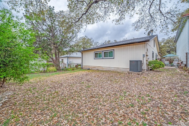 12938 Ocean Glade, San Antonio, TX 78249 - rear view of property with central air condition unit, fence, and a patio area
