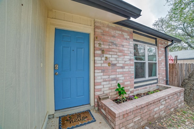 12938 Ocean Glade, San Antonio, TX 78249 - view of exterior entry with brick siding and fence