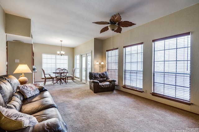 8633 Datapoint Unit 227, San Antonio, TX 78229 - carpeted living area with a chandelier and ceiling fan