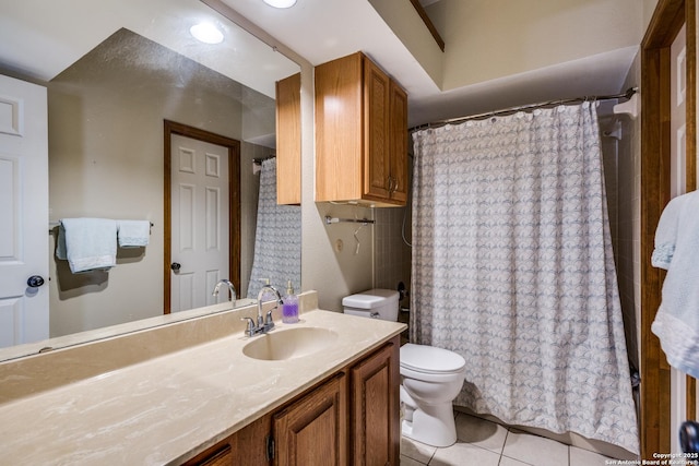 8633 Datapoint Unit 227, San Antonio, TX 78229 - full bathroom featuring tile patterned floors, toilet, vanity, and a shower with shower curtain