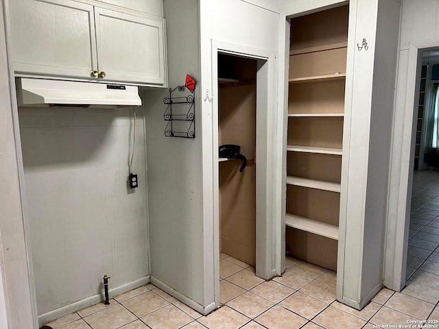 laundry room with light tile patterned floors