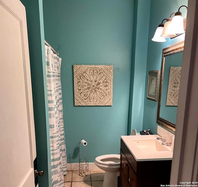 bathroom featuring tile patterned flooring, a shower with shower curtain, toilet, and vanity