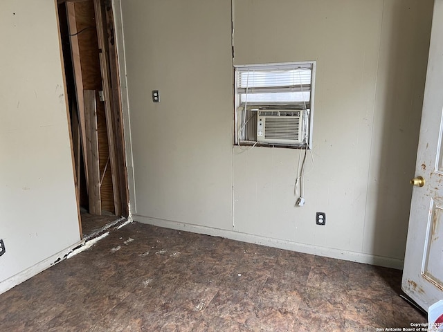 unfurnished room featuring cooling unit