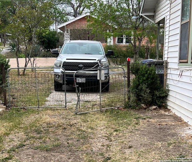view of yard featuring a fenced front yard and a gate