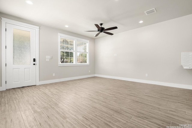 spare room with baseboards, visible vents, recessed lighting, ceiling fan, and light wood-type flooring