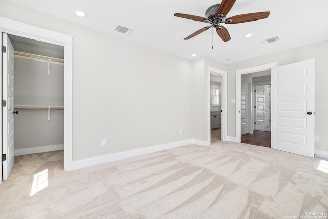 unfurnished bedroom with recessed lighting, carpet, and visible vents