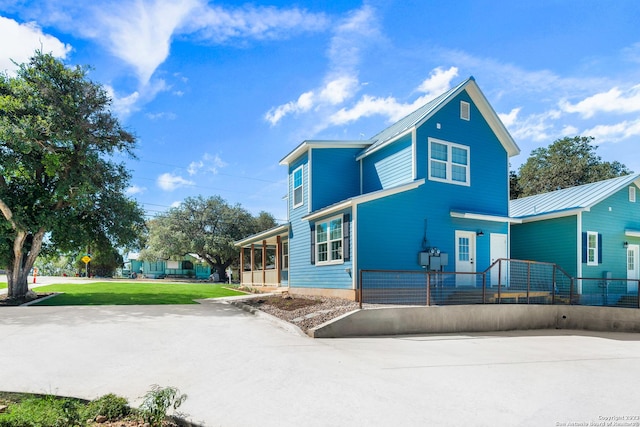 view of front of house featuring a front yard and a porch