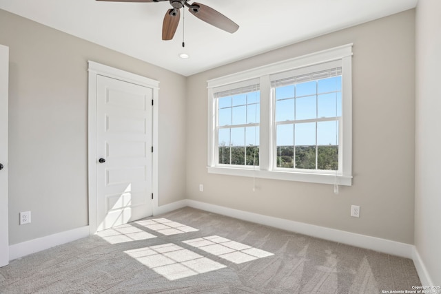 295 S E Ave, New Braunfels, TX 78130 - spare room with baseboards, carpet floors, and ceiling fan