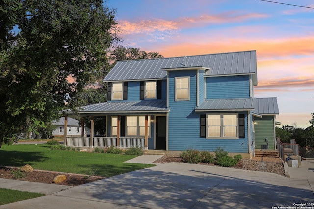 295 S E Ave, New Braunfels, TX 78130 - view of front facade with a porch, a standing seam roof, metal roof, and a front yard