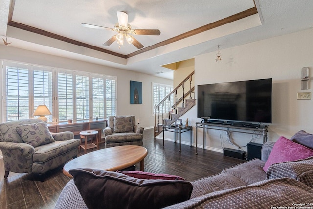 191 Campfire Cir, Fredericksburg, TX 78624 - living area featuring stairway, a ceiling fan, a raised ceiling, wood finished floors, and ornamental molding