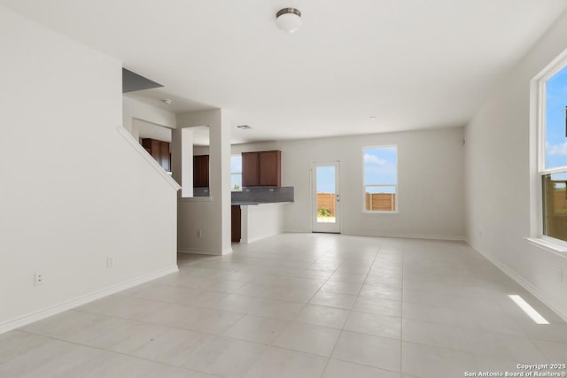 7804 Canyon Wren Park, San Antonio, TX 78253 - unfurnished living room featuring light tile patterned flooring and baseboards