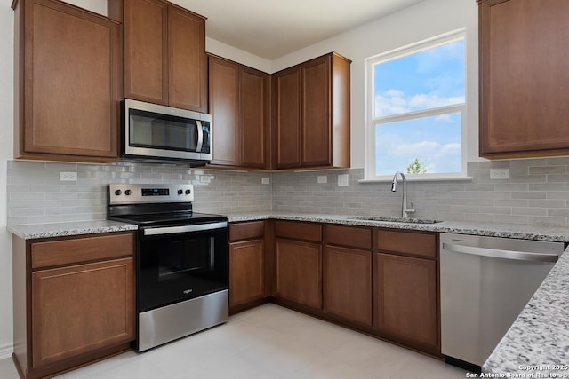 7804 Canyon Wren Park, San Antonio, TX 78253 - kitchen with appliances with stainless steel finishes, tasteful backsplash, and light stone counters