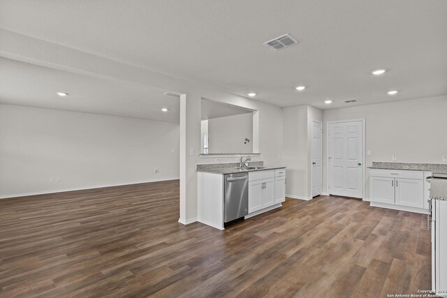819 Bluegrass Pt, New Braunfels, TX 78130 - kitchen with open floor plan, white cabinetry, stainless steel dishwasher, a sink, and visible vents