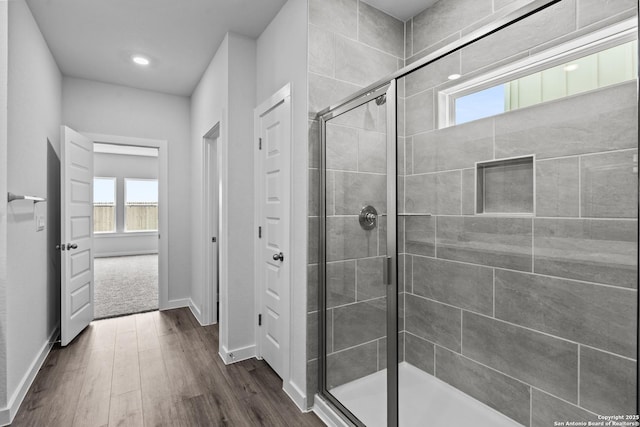 2074 Newforest Peak, New Braunfels, TX 78130 - full bathroom with plenty of natural light, a stall shower, wood finished floors, baseboards, and recessed lighting