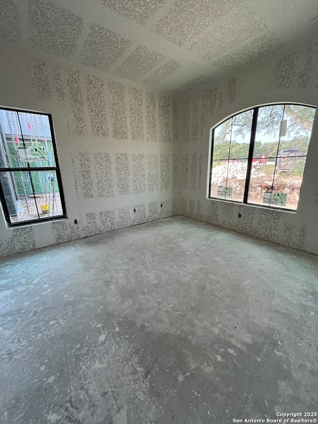 5668 Dry Comal, New Braunfels, TX 78132 - empty room with unfinished concrete floors