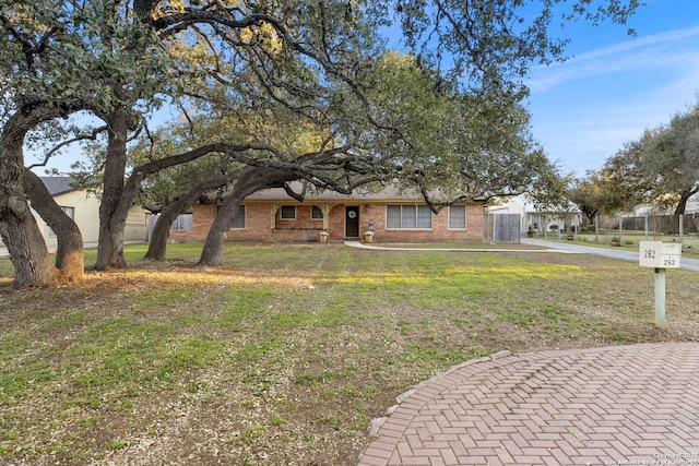 262 Rockhill Dr, San Antonio, TX 78209 - ranch-style home with brick siding and a front lawn